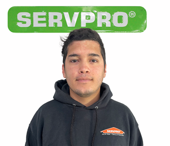 Eduardo, male, SERVPRO employee against a white background and green SERVPRO logo