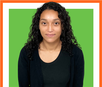 Ashley, servpro employee against a green background, woman
