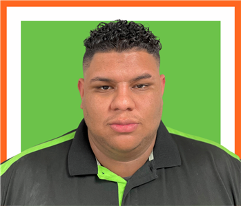 Norman, male, SERVPRO employee against a green background