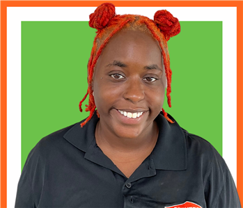 Dominica, servpro employee against a white background, woman