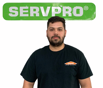 Victor, SERVPRO employee in uniform, cut out in front of white background