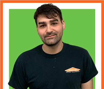 Richard, male, SERVPRO employee, cut out, against a white background, SERVPRO green sign above head